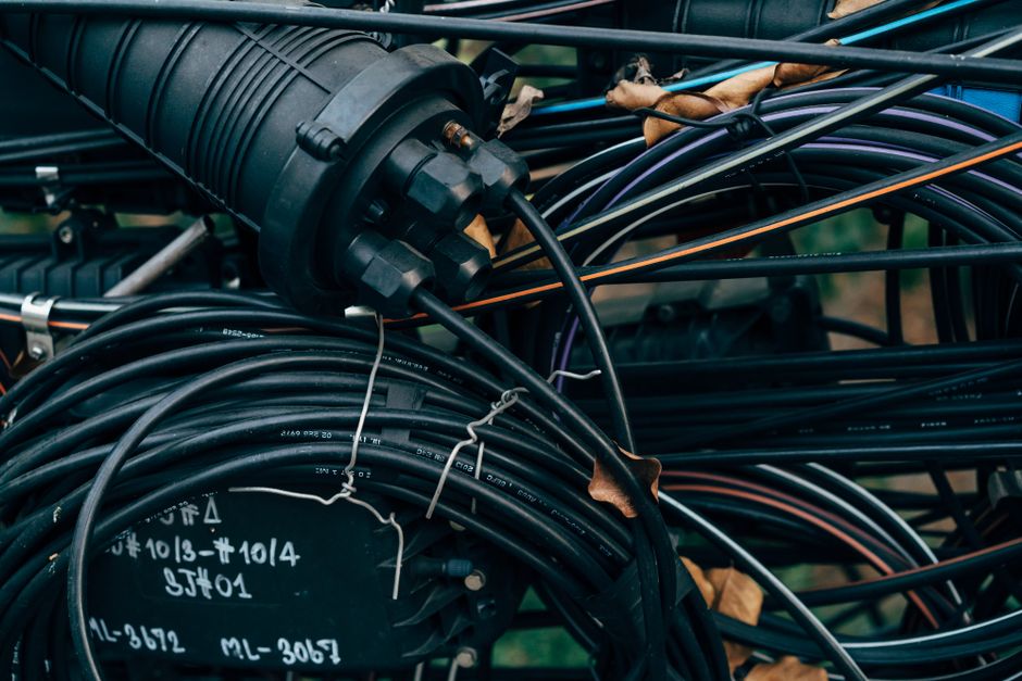 Fiber optic cables and a splice closure prepared for field termination