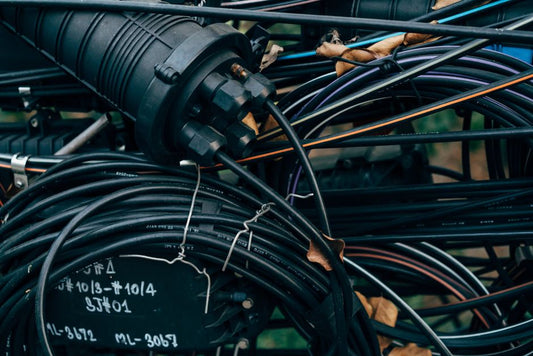Fiber optic cables and a splice closure prepared for field termination