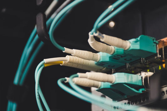 Fiber optic cables and ports in a network equipment room